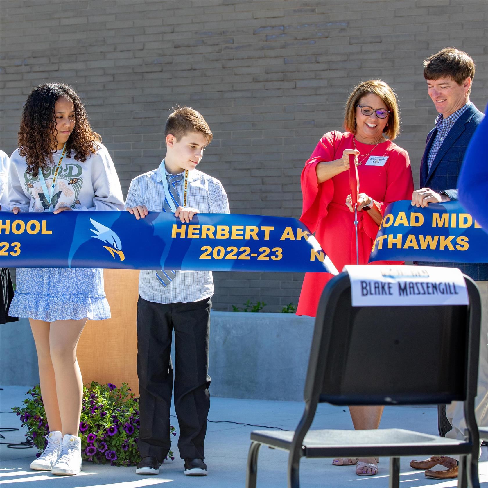  Principal Anne Marie Adkins cuts ribbon to mark the school's opening.